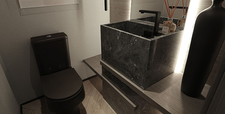 Uma fotografia de banheiro com paredes de tons claros com vaso sanitário e pia pretos.